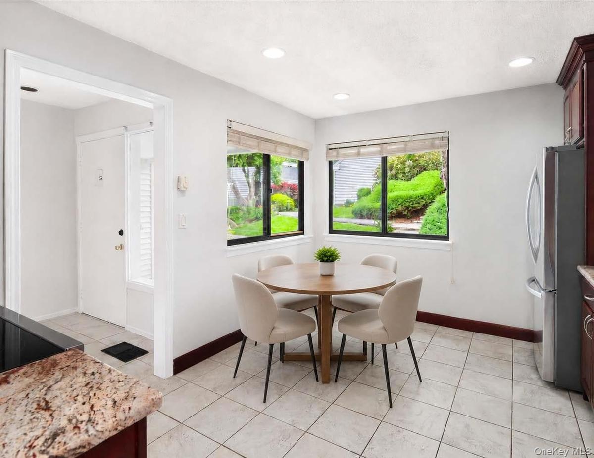 Digitally enhanced to add table and chairs