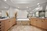 Spa-like primary bathroom with separate shower and tub