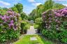 Private gardens leading to pool and pool house