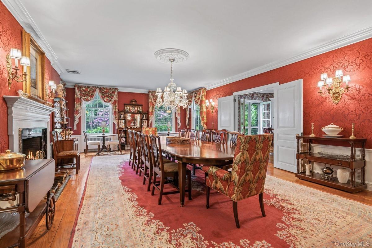 Banquet sized formal dining room with wood burning fireplace