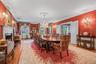 Banquet sized formal dining room with wood burning fireplace