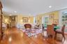 Sunroom with abundance of natural light and back staircase