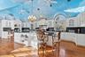 Large, sprawling kitchen with multiple seating areas