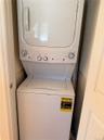 White stacked washer and dryer unit
