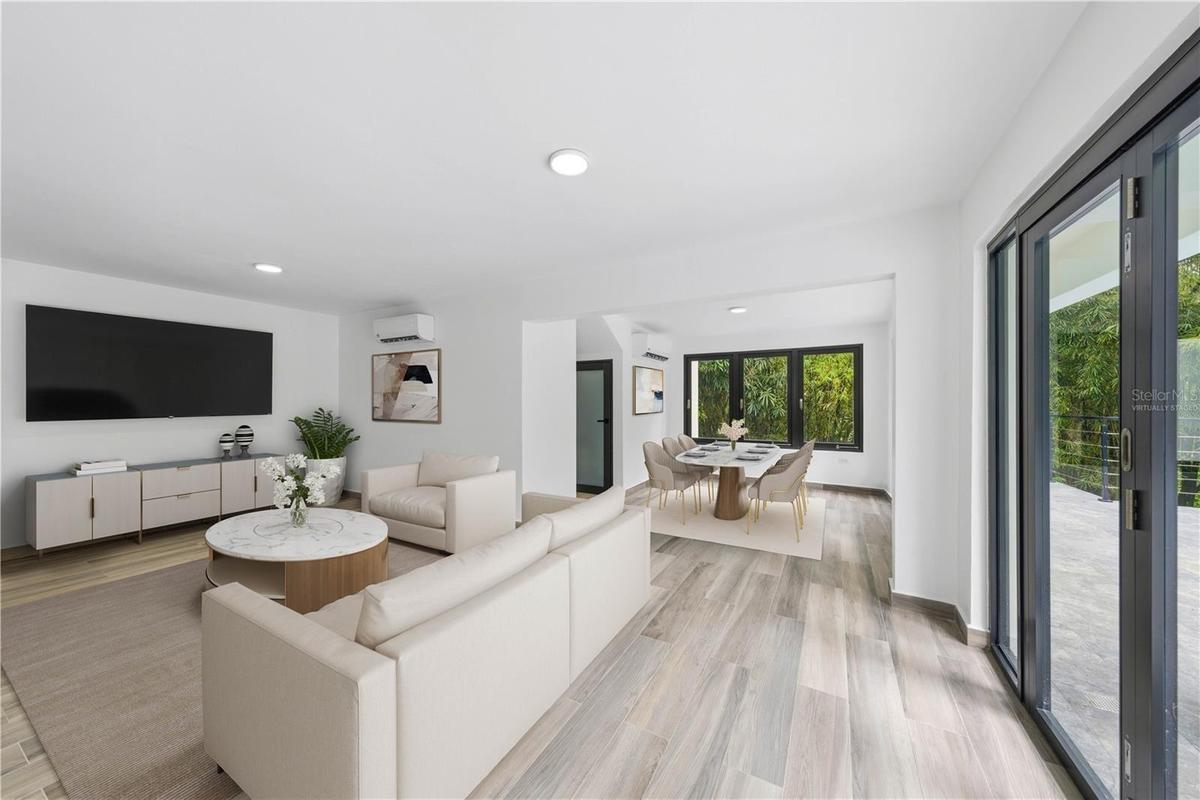 Great Room - This image has been virtually staged and does not reflect the current state of the property.