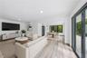 Great Room - This image has been virtually staged and does not reflect the current state of the property.