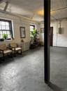 Finished are in basement leading to storage room, super's work area, and the boiler room