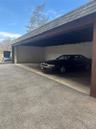 Another view of one of the covered carports in the rear of the building