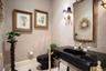 Downstairs half bath right off the office (5th bedroom, no closet)