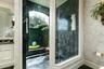 Such a serene space for showering with such an abundance of light peeking through.