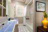 Downstairs bathroom right off the bedroom with the window seat. Such a functional split bedroom plan.