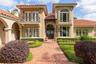 Generous use of St. Louis Brick, and stately balconies make for a regal entry.