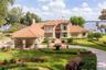 LUSH LANDSCAPING, sculptured flower beds, impressive PORTE-COCHERE. GAS LANTERNS, SHUTTERS, BALCONIES & TOWERING tree canopies as you approach this ME