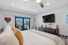 primary bedroom with water view and terrace access