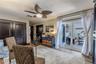 Sliding glass doors open to the front courtyard and feature both a retractable screen and a pull-down shade, allowing fresh air and natural light whil