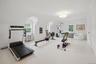 Playroom over 3 car garage currently use as home gym