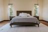 Bedroom featuring baseboards and wood finished floors