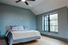Bedroom featuring light wood-style floors, vaulted ceiling, recessed lighting, and a ceiling fan