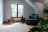 Sitting room with wood finished floors and lofted ceiling