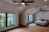 Bedroom with light wood-type flooring, vaulted ceiling, recessed lighting, and a ceiling fan