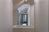 Hall featuring vaulted ceiling