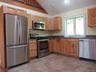 Tiled floor, granite counter, stainless steel appliances