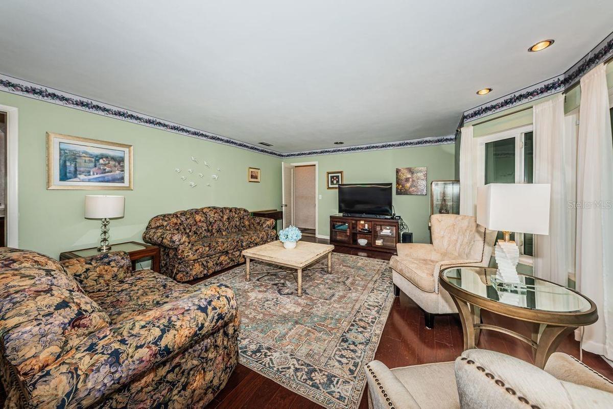Living room at front of house with lots of windows