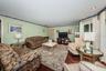Living room at front of house with lots of windows