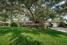 Front of house with mature landscaping