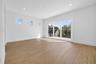 Primary suite with cascading sliders leading to patio deck