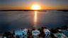 Wake each morning to spectacular bayfront sunrises.