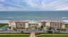 This beautifully maintained oceanfront community features two mid-rise buildings, a central pool area, and tennis courts—all nestled along the coast w
