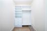 Primary bedroom walk in closet