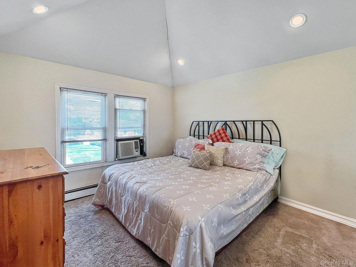 Master with vaulted ceilings and skylight