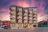 Modern multi-story building featuring a brick and panel facade, individual balconies with glass railings, large windows, an integrated ground-floor en