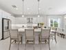 This kitchen features an oversized island with casual seating.