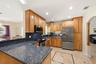 Your HUGE Kitchen includes SS Appliances, Tall Custome Cabinets with Crown Molding, LED Lighting, 18" Travertine Tile Floors, Granite Countertops, 2 S