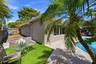 Tucked away next to your Poop and Rock Waterfall is a Lounge Oasis as well as a HUGE Side Yard for all needs, the Fence has a Wide Gate in the Front f