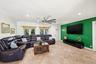 Big L-Shaped Living Room Perfect for Lounging Around or Entertaining. Room for Pool/Ping Pong Table, Foosball Table or Reading or Whatever You Can Ima