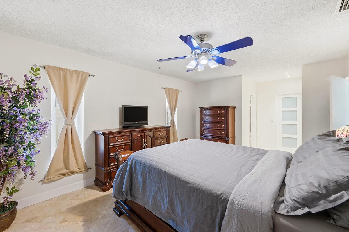 Big Primary Bedroom with En-Suite Bathroom & Bright Walk-In Closet with Frosted Glass Doors.