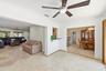 From Your Florida Room is Easy Access to the Living Room, Dining Room & The Amazing Waterfront Backyard Pool, Dock and Patio. Dining Room Chandelier d