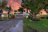 Welcome Home at Twilight! Aluminum Roof 2024, Impact Windows & Doors, HVAC 2020, 18" Travertine Flooring Inside 2025, Guest Bath 2025, Water Heater 20
