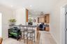 From the Dining Room to The Kitchen Includes a Snack Bar, Built-In Desk, Custome Cabinets, LED Lighting & 18" Travertine Tile Floors.