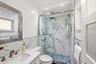 Guest Bathroom Updated 2025 with Glass Enclosed Shower and Frosted Glass Door and Window.