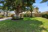 Beautiful, Mature, Lush Landscape surrounds the property. Lots of Parking with a Wide Gate on the South Side of the Home.