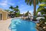 Imagine the momories You, Your Family & Friends will be making in the Tropical Waterfront Oasis, Lush Landscape, Pool with Rock Waterfall, Covered Pat