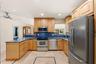 Your HUGE Kitchen includes SS Appliances, Tall Custome Cabinets with Crown Molding, LED Lighting, 18" Travertine Tile Floors, Granite Countertops, 2 S