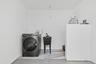 Laundry room featuring washer / dryer and concrete flooring