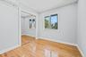 Unfurnished bedroom with an AC wall unit, light wood finished floors, a closet, and recessed lighting