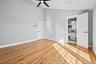 Spare room featuring light wood finished floors, high vaulted ceiling, a ceiling fan, and recessed lighting